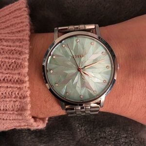 Silver fossil watch with light blue face